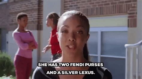 she has 2 fendi purses and a silver lexus|She has two Fendi purses and a silver Lexus. .